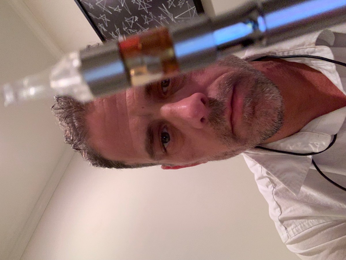 Close portrait with glass object